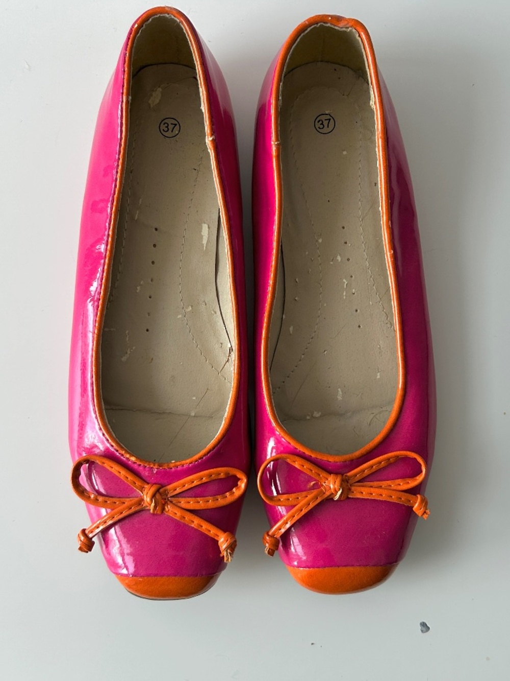 Pink and orange ballet flats in patent leather